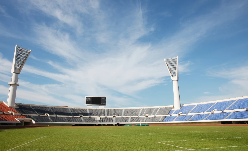 Bright LED lights illuminating a professional soccer field at night